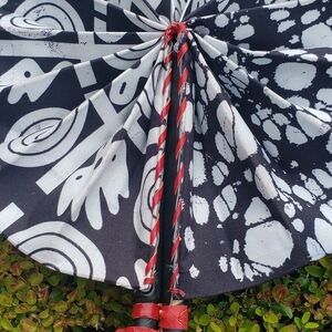 Elegant Black and White Folding Fan with Artistic Design